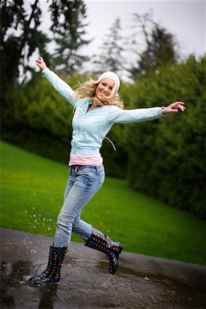rubber boots young girl - Woman Playing in the Rain, Portland, Oregon, USA Stock Photo - Rights-Managed, Code: 700-02222884