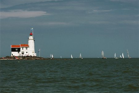 Lighthouse and Sailboats, Marken, North Holland, Netherlands Stock Photo - Rights-Managed, Code: 700-02223003