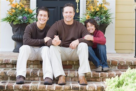 family portrait building - Portrait of Family Sitting on Porch Stock Photo - Rights-Managed, Code: 700-02231930