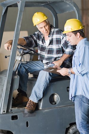 simsearch:600-00551102,k - Construction Worker With Clipboard Talking to Worker on Forklift Stock Photo - Rights-Managed, Code: 700-02231943