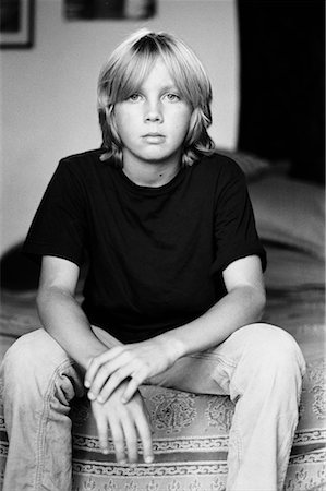 photography portraits in interiors black and white photos - Boy Sitting on Bed Stock Photo - Rights-Managed, Code: 700-02232030