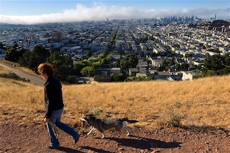 san francisco people - Woman Walking Dog in Bernal Heights, Downtown San Francisco in the Background, California, USA Stock Photo - Rights-Managed, Code: 700-02232129