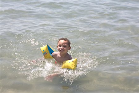 Natation garçon avec flotteurs Photographie de stock - Rights-Managed, Code: 700-02244923