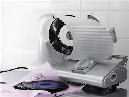 record album - Record Albums Going through Meat Slicer Stock Photo - Rights-Managed, Code: 700-02245325