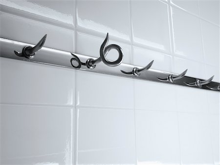 Close-up of Hooks in Butcher Shop with One Curled Hook Fotografie stock - Rights-Managed, Codice: 700-02245690