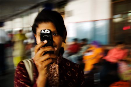 Woman Taking Picture With Camera Phone, Haridwar, India Stock Photo - Rights-Managed, Code: 700-02245961