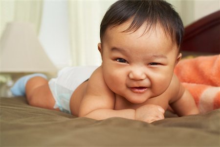 funny baby facial expressions - Portrait of Baby on Bed Stock Photo - Rights-Managed, Code: 700-02264109