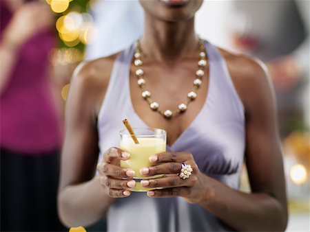 festa di natale - Close-up of Woman Holding Drink at Christmas Party Fotografie stock - Rights-Managed, Codice: 700-02264275