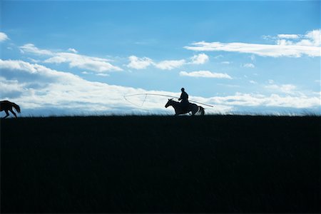 silhouette person running - Silhouette of Horsmean Herding Horses, Inner Mongolia, China Stock Photo - Rights-Managed, Code: 700-02264829