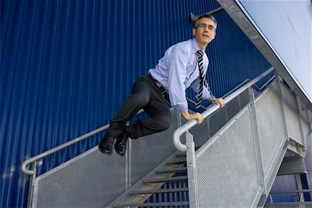 sauter de joie - Homme d'affaires saut hors escalier Photographie de stock - Rights-Managed, Code: 700-02264865