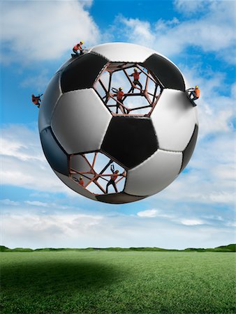 Gebäude-Arbeitnehmer-Gebäude einen Fußball Stockbilder - Lizenzpflichtiges, Bildnummer: 700-02264971