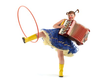 fisarmonica - Portrait of a Clown Playing an Accordion and Spinning a Hula Hoop With Her Leg Fotografie stock - Rights-Managed, Codice: 700-02265021