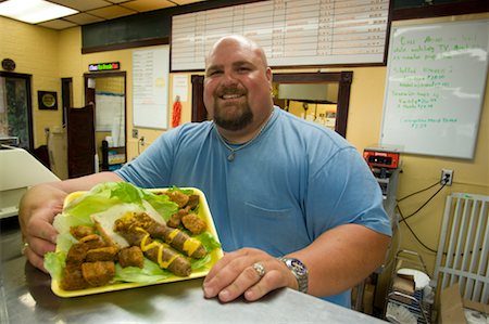 fat man with goatee - Homme desservant le plateau de la viande, Lafayette, Louisiane, Etats-Unis Photographie de stock - Rights-Managed, Code: 700-02265180