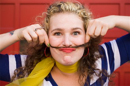 Woman Making Moustache with Hair Foto de stock - Con derechos protegidos, Código: 700-02265265