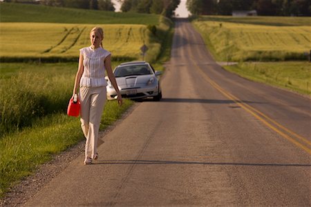 people with broken down cars - Woman Walking Along Country Road, Carrying Gas Can Stock Photo - Rights-Managed, Code: 700-02260106