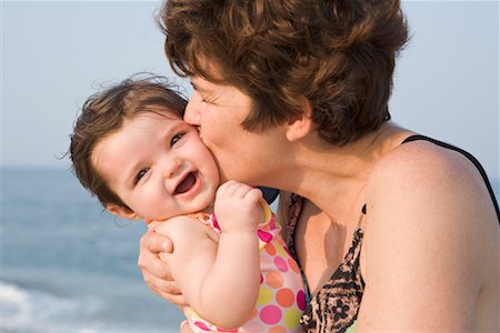 portraits of everyday people - Mother Kissing Baby Girl at the Beach, New Jersey, USA Stock Photo - Rights-Managed, Code: 700-02263991