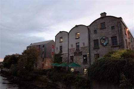 Shops and Old Mill by River, River Corrib, Galway, County Galway, Ireland Stock Photo - Rights-Managed, Code: 700-02289014