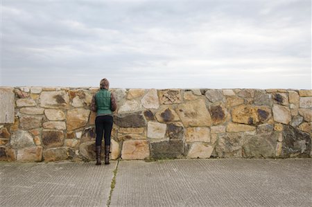 simsearch:700-02289029,k - Woman Looking over Stone Wall, Spiddal, County Galway, Galway, Ireland Stock Photo - Rights-Managed, Code: 700-02289039