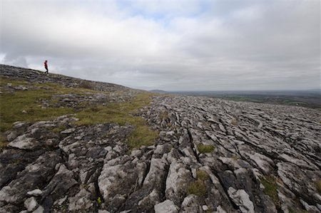 simsearch:700-02289029,k - Woman Hiking Across Field, Slieve Rua, Burren National Park, County Clare, Ireland Stock Photo - Rights-Managed, Code: 700-02289057