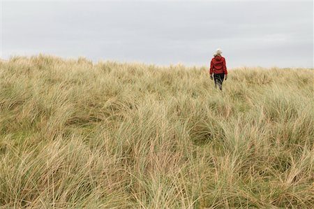 Woman Walking in Field of Long Grass, Inishmore, Aran Islands, County Galway, Ireland Stock Photo - Rights-Managed, Code: 700-02289065