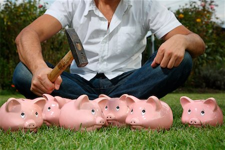 financial gain - Man Breaking Piggy Banks with Hammer Stock Photo - Rights-Managed, Code: 700-02289315