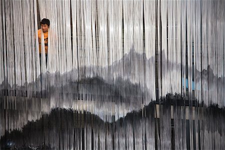 Man Looking through Hanging Tassels, Insadong, Seoul, South Korea Stock Photo - Rights-Managed, Code: 700-02289671