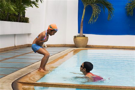 swimming pool and children and swim cap - Girls Playing in Pool Stock Photo - Rights-Managed, Code: 700-02314925