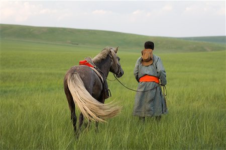 simsearch:700-02314934,k - Horseman Walking with Horse, Inner Mongolia, China Foto de stock - Con derechos protegidos, Código: 700-02314933