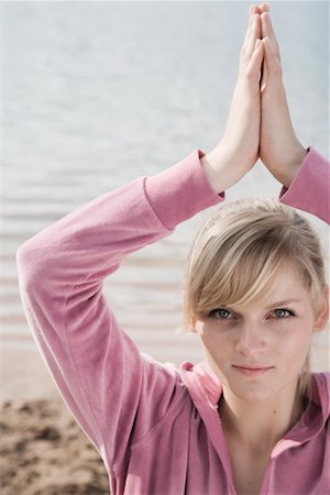 Woman Doing Yoga on the Beach, Nuremburg, Bavaria, Germany Stock Photo - Rights-Managed, Code: 700-02345977