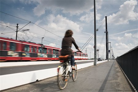 Cyclist and Streetcar on Bridge, Dusseldorf, North Rhine- Westphalia, Germany Foto de stock - Con derechos protegidos, Código: 700-02346010