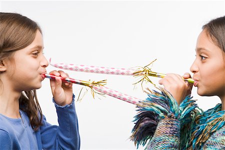 silly ethnic family - Little Girls Blowing Noisemakers Stock Photo - Rights-Managed, Code: 700-02346371