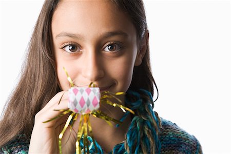 Little Girl Blowing Noisemaker Foto de stock - Con derechos protegidos, Código: 700-02346373