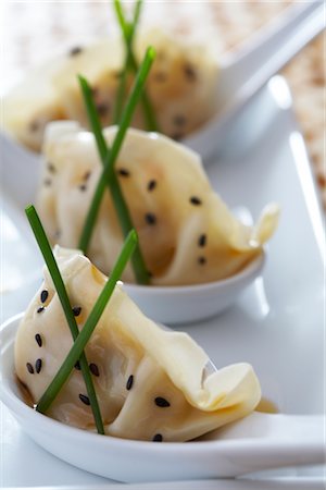 Chinese Dumplings With Toasted Sesame Seeds, Soy Sauce, and Chives Stock Photo - Rights-Managed, Code: 700-02347866