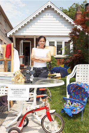 Woman Selling Items at a Garage Sale Stock Photo - Rights-Managed, Code: 700-02347889