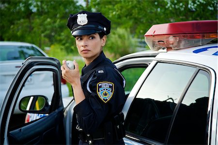 police car with siren - Police Woman with Cruiser at Side of Road, Toronto, Ontario, Canada Stock Photo - Rights-Managed, Code: 700-02348230