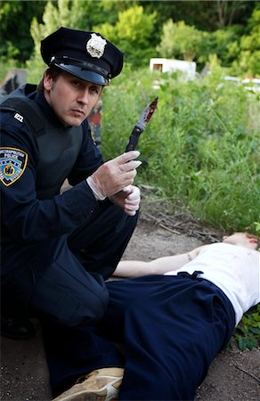 detective investigation - Police Officer with Corpse and Bloody Knife, Toronto, Ontario, Canada Stock Photo - Rights-Managed, Code: 700-02348269