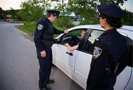 police officer (male) - Police with Car at Side of Road, Toronto, Ontario, Canada Stock Photo - Rights-Managed, Code: 700-02348275
