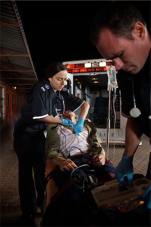 female patient strapped - Paramedics with Injured Man by Ambulance, Toronto, Ontario, Canada Stock Photo - Rights-Managed, Code: 700-02348278