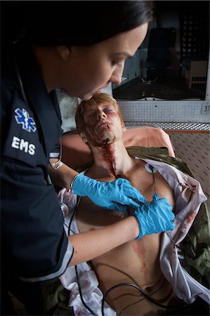 Paramedic with Injured Man by Ambulance, Toronto, Ontario, Canada Fotografie stock - Rights-Managed, Codice: 700-02348279