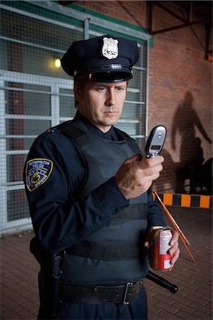Police Officer with Cellar Phone, Toronto, Ontario, Canada Foto de stock - Con derechos protegidos, Código: 700-02348290