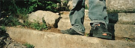 standing on toes - Close-up of Boy's Shoes With Big Toe Sticking Out Stock Photo - Rights-Managed, Code: 700-02348603