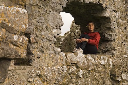 Woman Sitting in Window of Kilmacduagh Monastery, Kilmacduagh, County Galway, Ireland Stock Photo - Rights-Managed, Code: 700-02348648