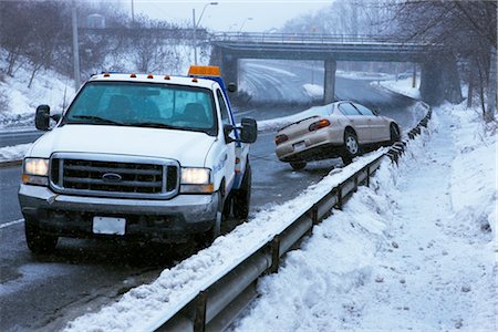 severe - Tow Truck and Car Stuck on Guard Rail on Icy Highway, Toronto, Ontario, Canada Stock Photo - Rights-Managed, Code: 700-02348737