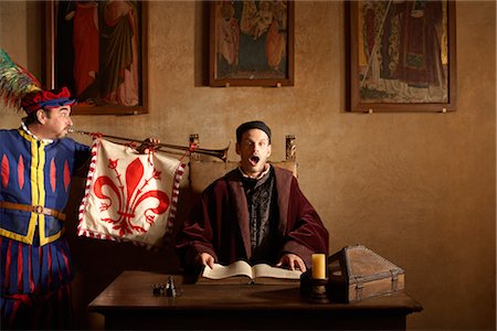 flags business - Medieval Jester Blowing Trumpet in Man's Ear, Mugello, Tuscany, Italy Stock Photo - Rights-Managed, Code: 700-02376722