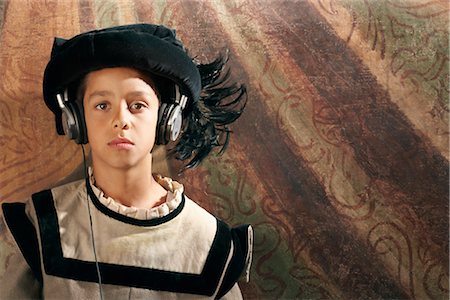 Medieval Boy Listing to Headphones, Mugello, Tuscany, Italy Stock Photo - Rights-Managed, Code: 700-02376736