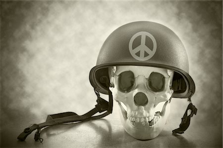 Skull Wearing an Army Helmet Decorated With a Peace Sign Stock Photo - Rights-Managed, Code: 700-02377124