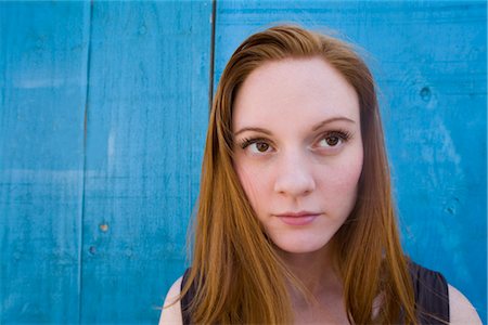 Portrait of Woman by Blue Wall Foto de stock - Con derechos protegidos, Código: 700-02377135