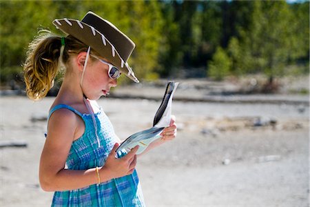 Girl Reading Map, Yellowstone National Park, Wyoming, USA Stock Photo - Rights-Managed, Code: 700-02371224