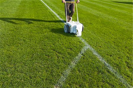 Man Painting Lines on Soccer Field, Salzburg, Austria Foto de stock - Con derechos protegidos, Código: 700-02371445
