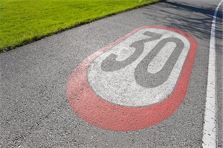 painted words - Speed Limit Sign, Salzburg, Austria Stock Photo - Rights-Managed, Code: 700-02371446